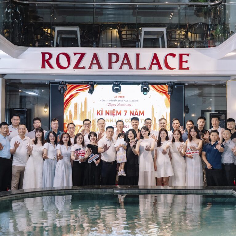 Company anniversary group photo by the pool at Roza Palace, Cat Ba