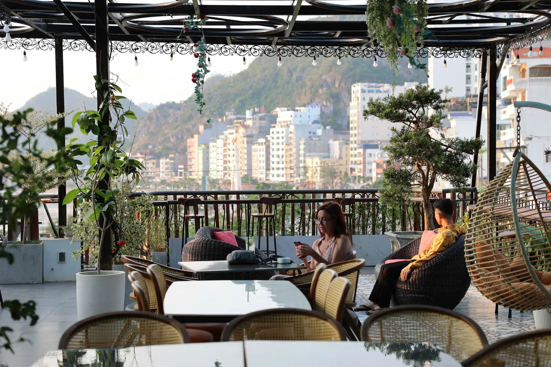 Roza Bar rooftop terrace with views over Cat Ba Town and the limestone hills