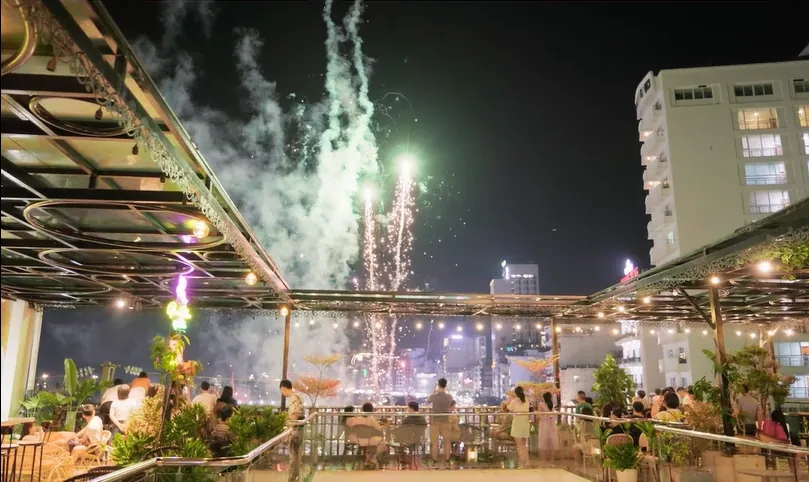 Guests watching fireworks from the Roza Bar rooftop in Cat Ba Town