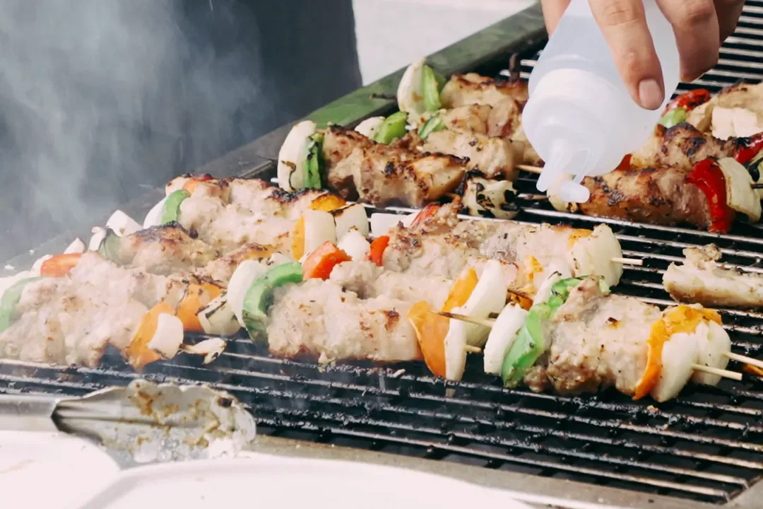 Pork and vegetable skewers on the grill at the Saturday BBQ, Roza, Cat Ba