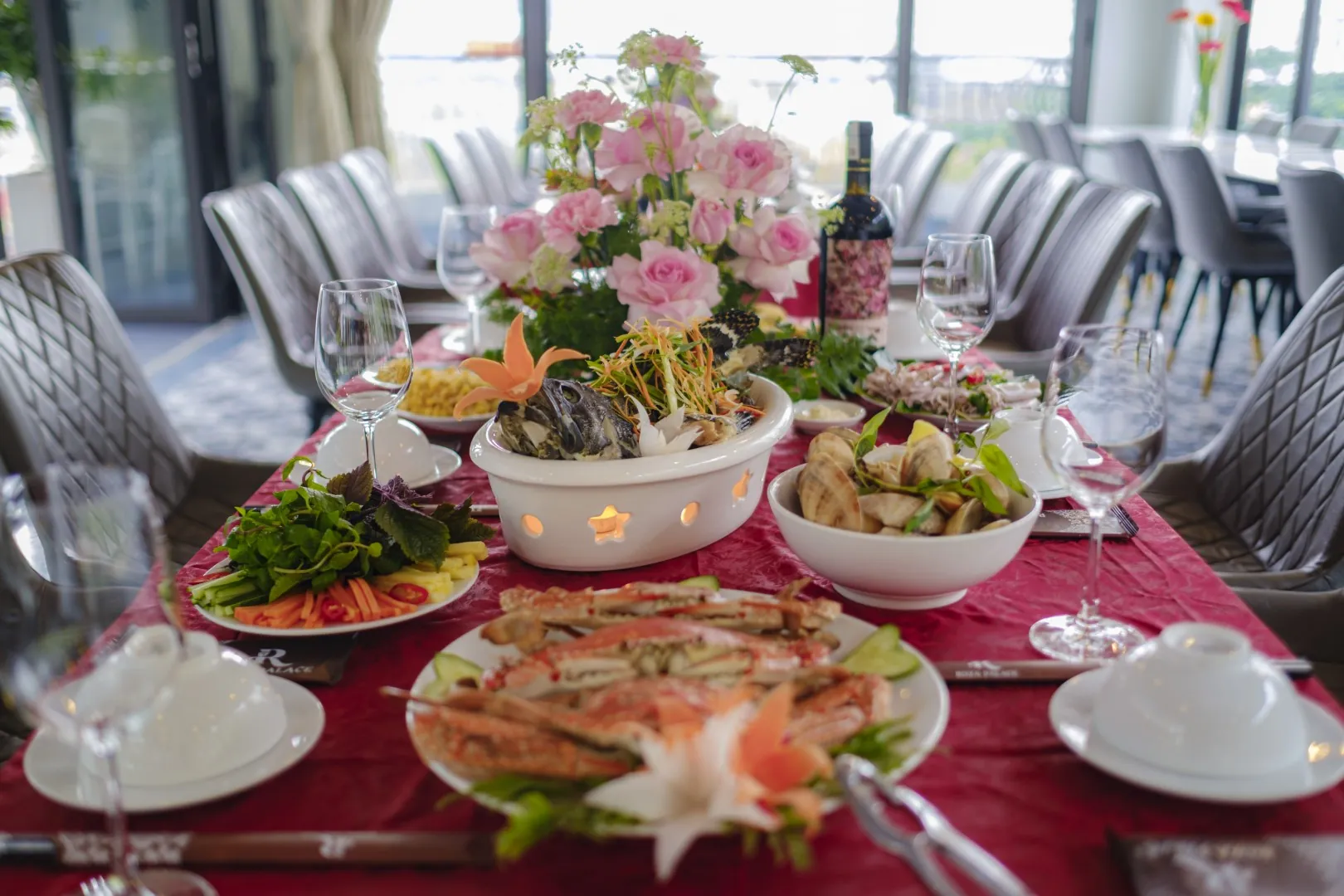 Seafood set menu with crab, clams and salads at Roza Restaurant, Cat Ba